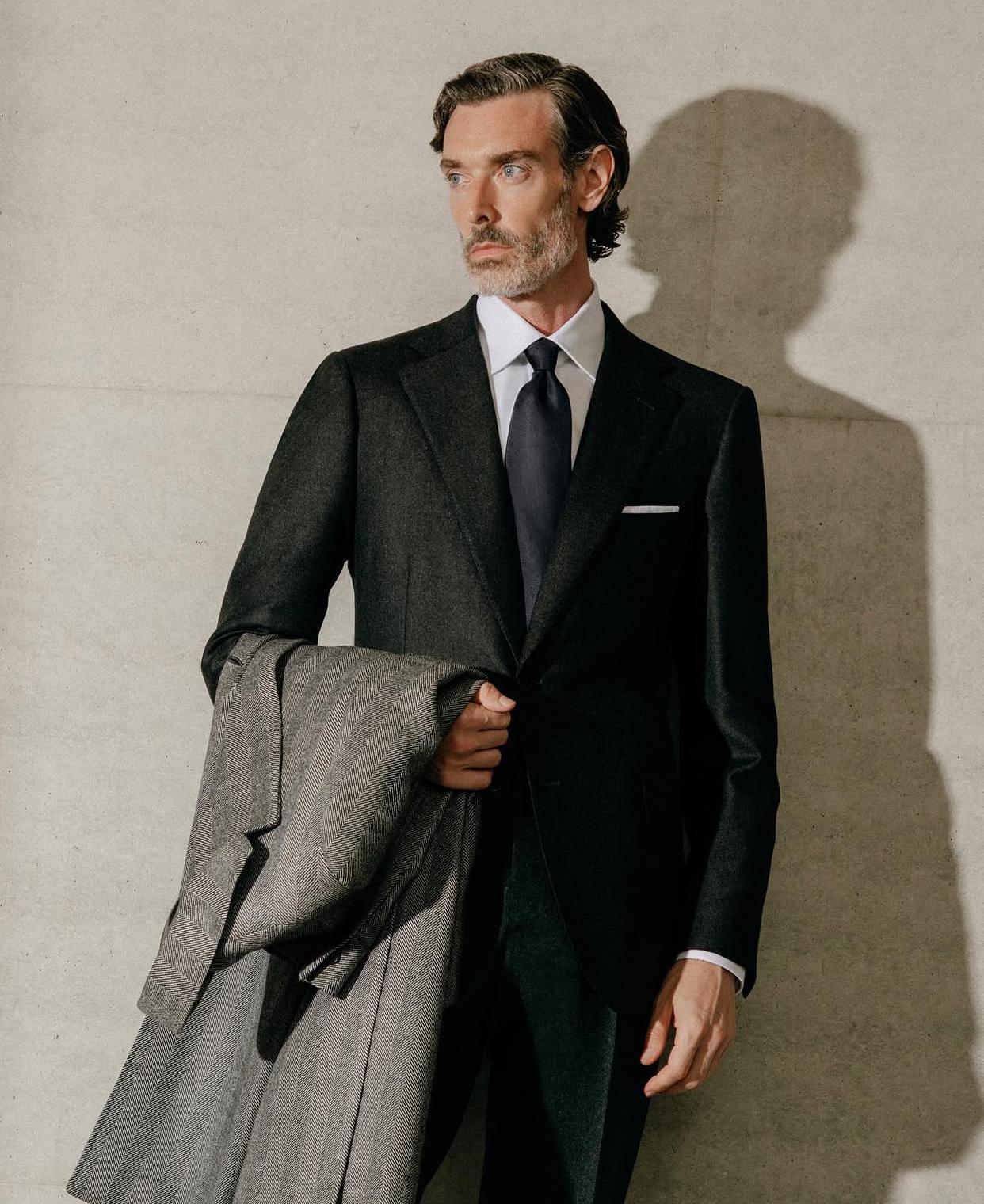 Tailoring product study with coat draped over arm